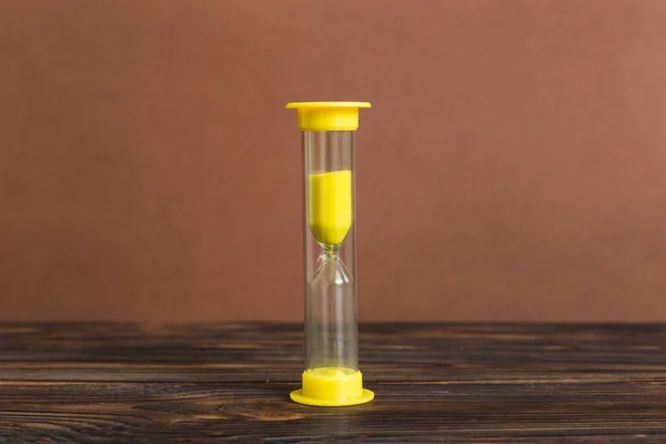hourglass on the table, sand clock as time passing concept for business deadline, copy space.