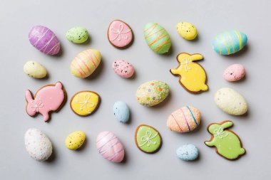 Happy Easter concept. Preparation for holiday. Easter eggs on colored background. flat lay top view copy space banner.