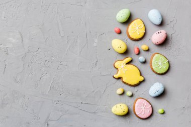 Happy Easter concept. Preparation for holiday. Easter eggs on colored background. flat lay top view copy space banner.