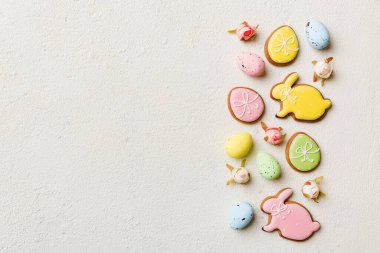 Happy Easter concept. Preparation for holiday. Easter eggs on colored background. flat lay top view copy space banner.