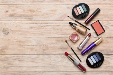 Professional makeup tools. Top view. Flat lay. Beauty, decorative cosmetics. Makeup brushes set and color eyeshadow palette on table background. Minimalistic style.