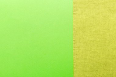 top view with green kitchen napkin isolated on table background. Folded cloth for mockup with copy space, Flat lay. Minimal style.