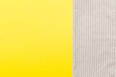 top view with gray kitchen napkin isolated on table background. Folded cloth for mockup with copy space, Flat lay. Minimal style.