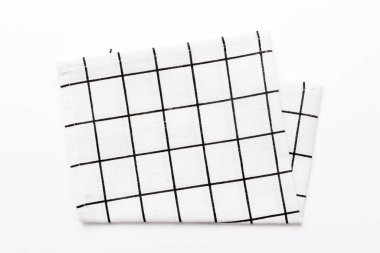 top view with white empty kitchen napkin isolated on table background. Folded cloth for mockup with copy space, Flat lay. Minimal style.