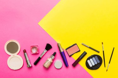 Professional makeup tools. Top view. Flat lay. Beauty, decorative cosmetics. Makeup brushes set and color eyeshadow palette on table background. Minimalistic style.