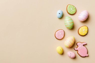Happy Easter concept. Preparation for holiday. Easter eggs on colored background. flat lay top view copy space banner.