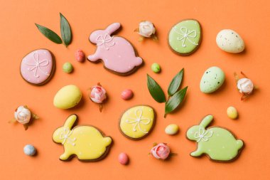 Happy Easter concept. Preparation for holiday. Easter eggs on colored background. flat lay top view copy space banner.