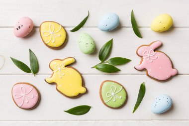 Happy Easter concept. Preparation for holiday. Easter eggs on colored background. flat lay top view copy space banner.