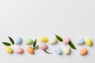 Happy Easter concept. Preparation for holiday. Easter eggs on colored background. flat lay top view copy space banner.