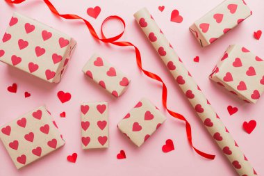 Creative gift box with decorations for the holiday, top view. Birthday and valentine present.