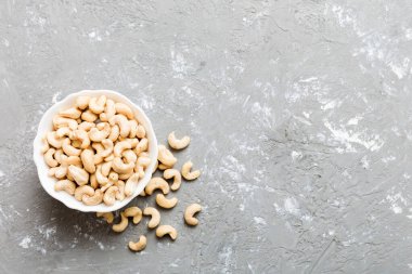 cashew nuts in wooden bowl on table background. top view. Space for text. Healthy food