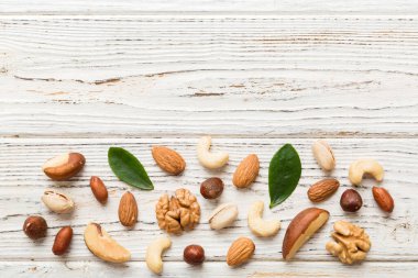 Composition of nuts , flat lay - mix hazelnuts, cashews, almonds on table background. healthy eating concepts and food background.