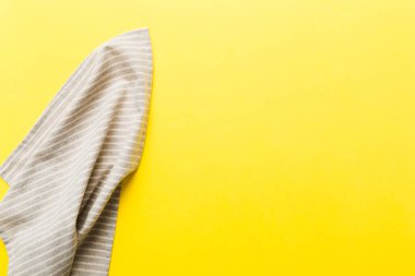top view with gray kitchen napkin isolated on table background. Folded cloth for mockup with copy space, Flat lay. Minimal style.