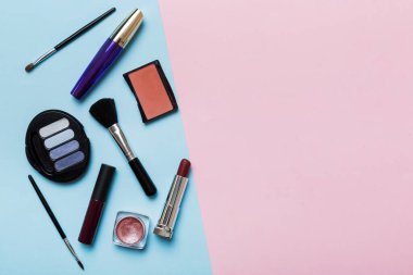 Professional makeup tools. Top view. Flat lay. Beauty, decorative cosmetics. Makeup brushes set and color eyeshadow palette on table background. Minimalistic style.