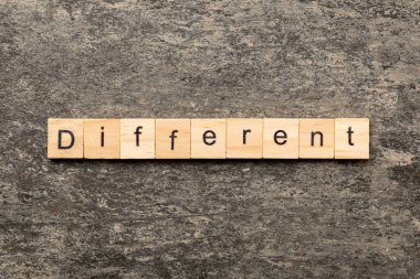 different word written on wood block. different text on table, concept