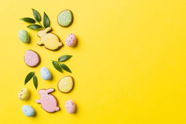 Happy Easter concept. Preparation for holiday. Easter eggs on colored background. flat lay top view copy space banner.