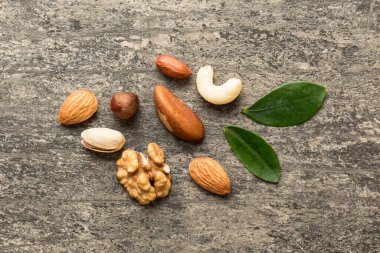 Composition of nuts , flat lay - mix hazelnuts, cashews, almonds on table background. healthy eating concepts and food background.
