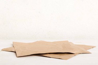 top view with baking parchment empty on table background. Folded cloth for mockup with copy space, Flat lay. Minimal style.