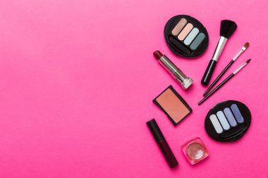 Professional makeup tools. Top view. Flat lay. Beauty, decorative cosmetics. Makeup brushes set and color eyeshadow palette on table background. Minimalistic style.