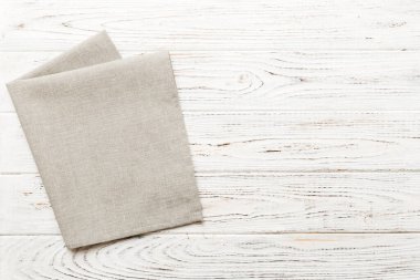 top view with gray kitchen napkin isolated on table background. Folded cloth for mockup with copy space, Flat lay. Minimal style.