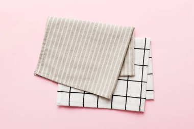 top view with gray kitchen napkin isolated on table background. Folded cloth for mockup with copy space, Flat lay. Minimal style.