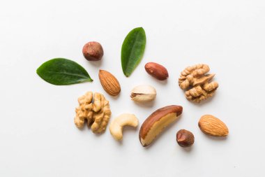 Composition of nuts , flat lay - mix hazelnuts, cashews, almonds on table background. healthy eating concepts and food background.