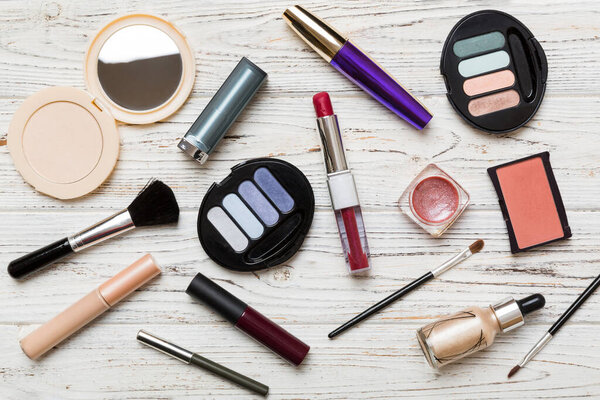 Professional makeup tools. Top view. Flat lay. Beauty, decorative cosmetics. Makeup brushes set and color eyeshadow palette on table background. Minimalistic style.