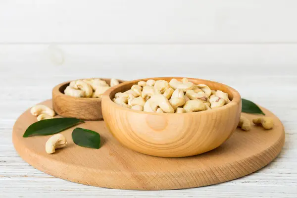 Cashew Nuts Wooden Bowl Table Background Top View Space Text — ストック写真