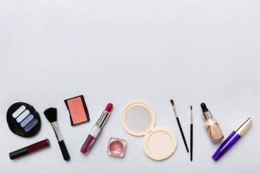 Professional makeup tools. Top view. Flat lay. Beauty, decorative cosmetics. Makeup brushes set and color eyeshadow palette on table background. Minimalistic style.