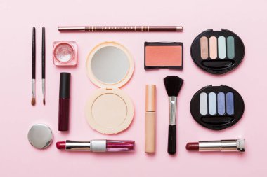 Professional makeup tools. Top view. Flat lay. Beauty, decorative cosmetics. Makeup brushes set and color eyeshadow palette on table background. Minimalistic style.