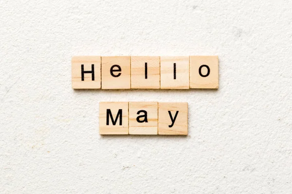hello May word written on wood block. hello May text on table, concept.