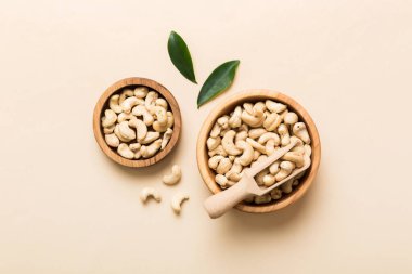 cashew nuts in wooden bowl on table background. top view. Space for text. Healthy food