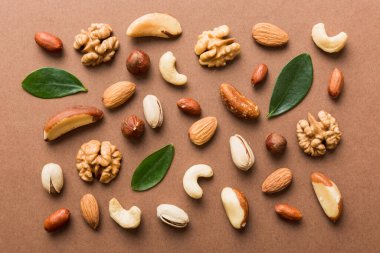 Composition of nuts , flat lay - mix hazelnuts, cashews, almonds on table background. healthy eating concepts and food background.