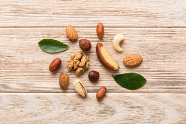 Composition of nuts , flat lay - mix hazelnuts, cashews, almonds on table background. healthy eating concepts and food background.
