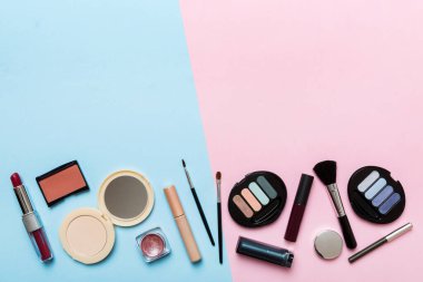 Professional makeup tools. Top view. Flat lay. Beauty, decorative cosmetics. Makeup brushes set and color eyeshadow palette on table background. Minimalistic style.