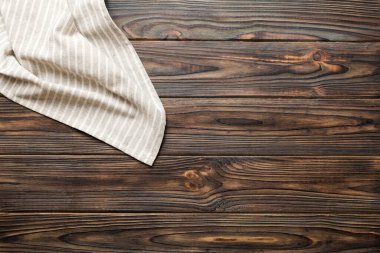 top view with gray kitchen napkin isolated on table background. Folded cloth for mockup with copy space, Flat lay. Minimal style.