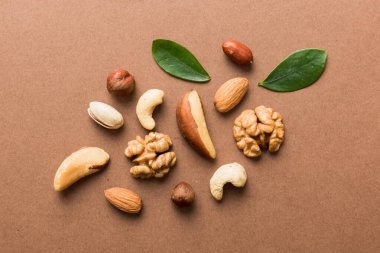 Composition of nuts , flat lay - mix hazelnuts, cashews, almonds on table background. healthy eating concepts and food background.