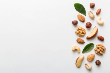 Composition of nuts , flat lay - mix hazelnuts, cashews, almonds on table background. healthy eating concepts and food background.