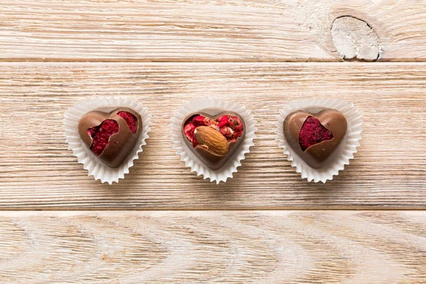 Chocolate Sweets Form Heart Fruits Nuts Colored Background Top View — Fotografia de Stock