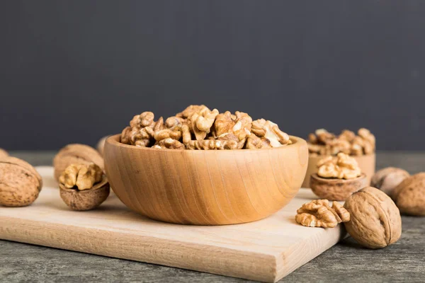 Stock image Fresh healthy walnuts in bowl on colored table background. Top view Healthy eating bertholletia concept. Super foods.