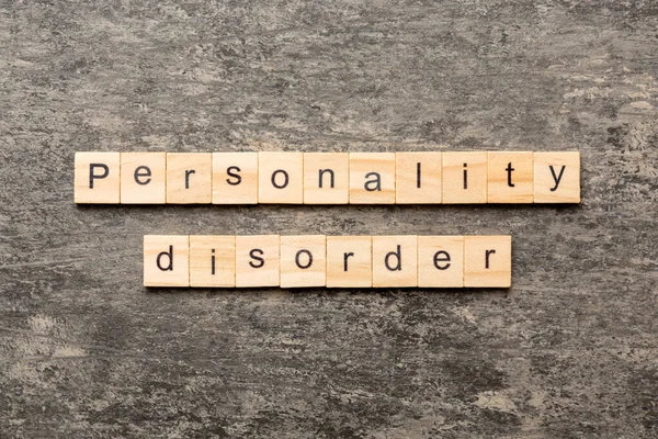 Personality disorder word written on wood block. Personality disorder text on table, concept.