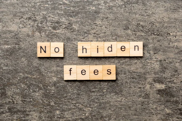 no hidden fees word written on wood block. no hidden fees text on table, concept.