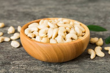 cashew nuts in wooden bowl on table background. top view. Space for text. Healthy food
