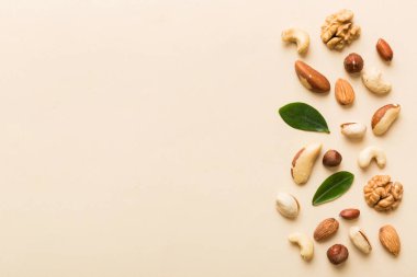 Composition of nuts , flat lay - mix hazelnuts, cashews, almonds on table background. healthy eating concepts and food background.