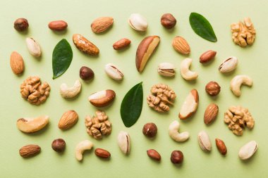Composition of nuts , flat lay - mix hazelnuts, cashews, almonds on table background. healthy eating concepts and food background.