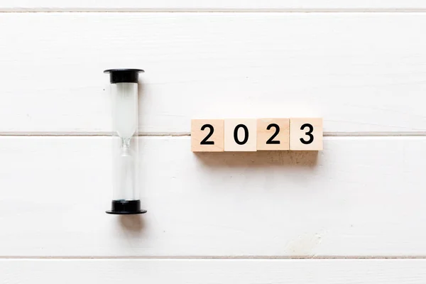 stock image New Year 2023 sand timer. Resolution, time, plan, goal, motivation, reboot, countdown and New Year holiday concepts. Hourglass with number 2023.