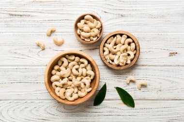 cashew nuts in wooden bowl on table background. top view. Space for text. Healthy food
