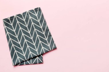 top view with blue kitchen napkin isolated on table background. Folded cloth for mockup with copy space, Flat lay. Minimal style.