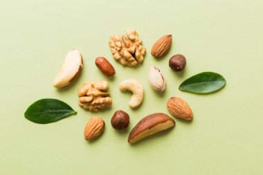 Composition of nuts , flat lay - mix hazelnuts, cashews, almonds on table background. healthy eating concepts and food background.