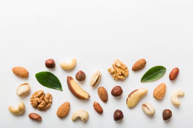 Composition of nuts , flat lay - mix hazelnuts, cashews, almonds on table background. healthy eating concepts and food background.